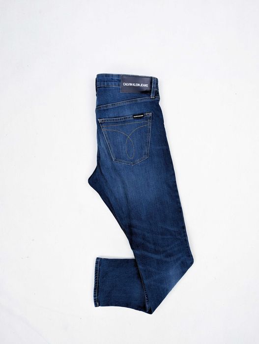 Calvin Klein niebieskie spodnie jeansy 33x32 L