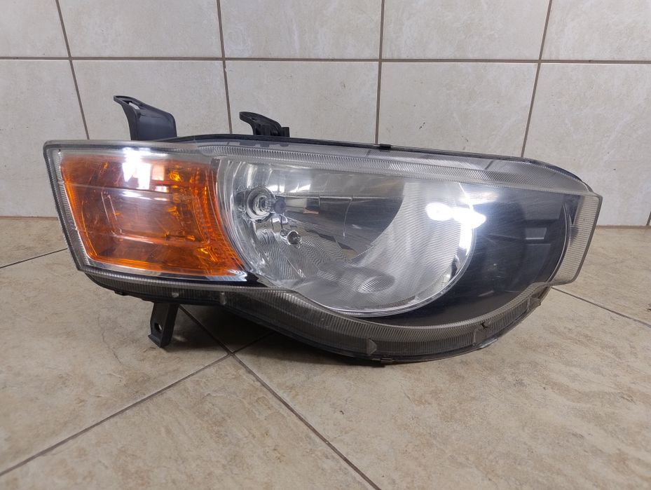 Mitsubishi Colt VI Z30 08- lift lampa reflektor Europa oryg prawy