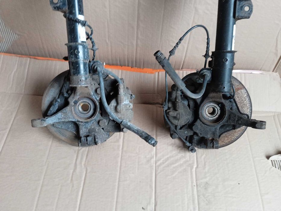 OPEL CORSA E 3D zwrotnica mcperson amortyzator piasta lewa prawa