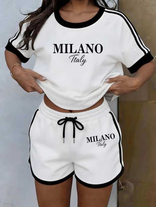 Sportowy zestaw dwuczęściowy: biały top i szorty z czarnymi wykończeniami i nadrukiem "milano italy"