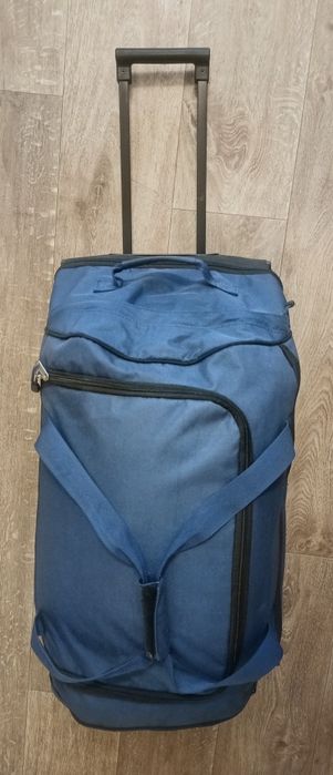 Дорожна  валіза з двойним дном на колесах.