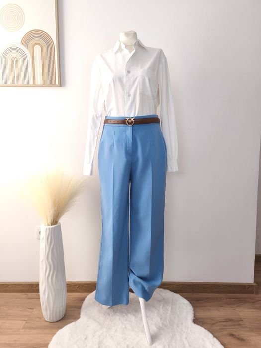 Błękitne eleganckie spodnie damskie rozmiar L w kant prosta nogawka