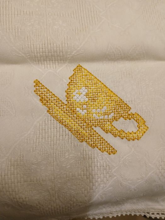 Hand-embroidered tea towel with cross-stitch