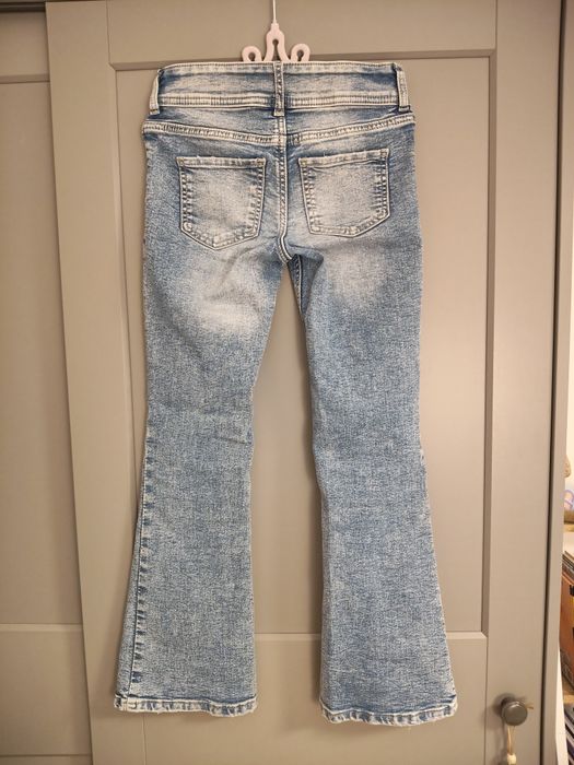 H&M spodnie dla dziewczynki dżinsy dzwony flared leg, 134