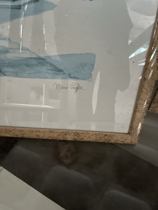 15 quadros azuis e brancos, com moldura