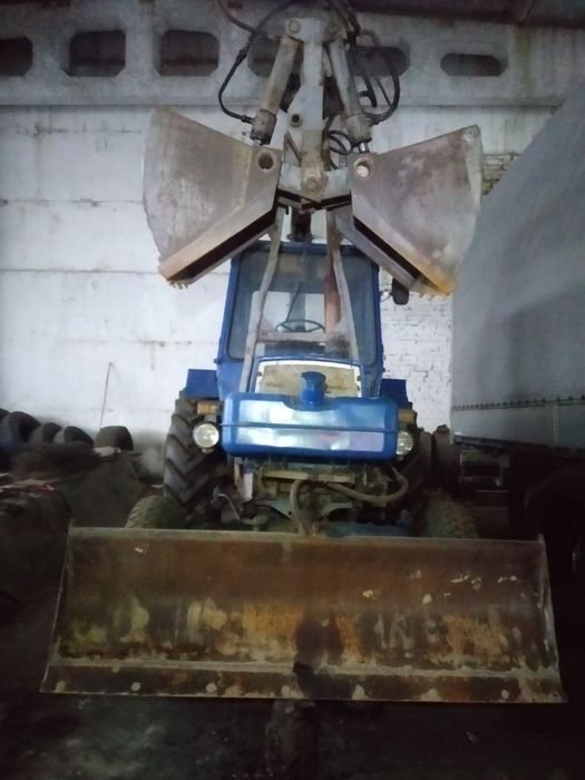 Грейферний погрузчик