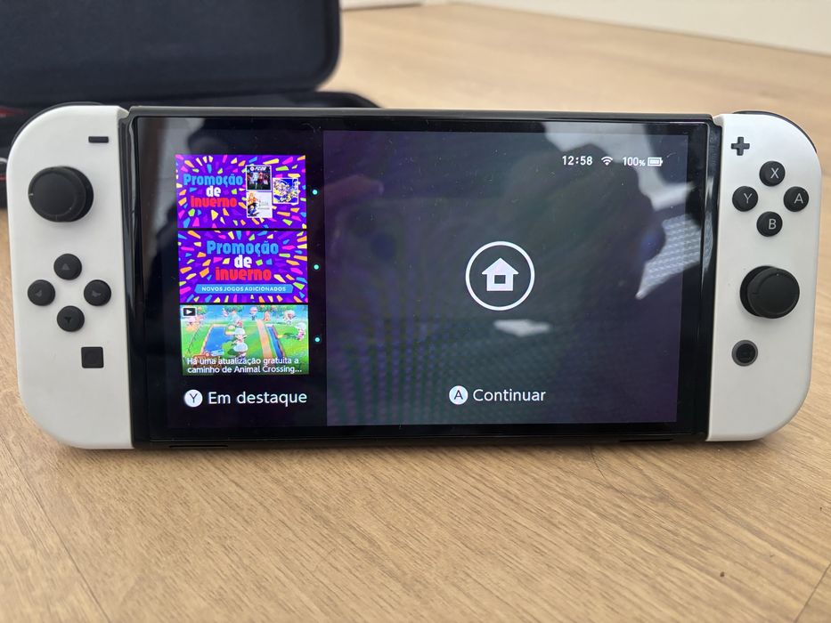 Nintendo switch oled + bolsa de transporte + jogo