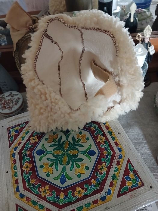 Proteccao de calcanhares em pele de carneiro