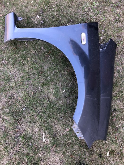 Blotnik przedni prawy Fiat Punto Evo