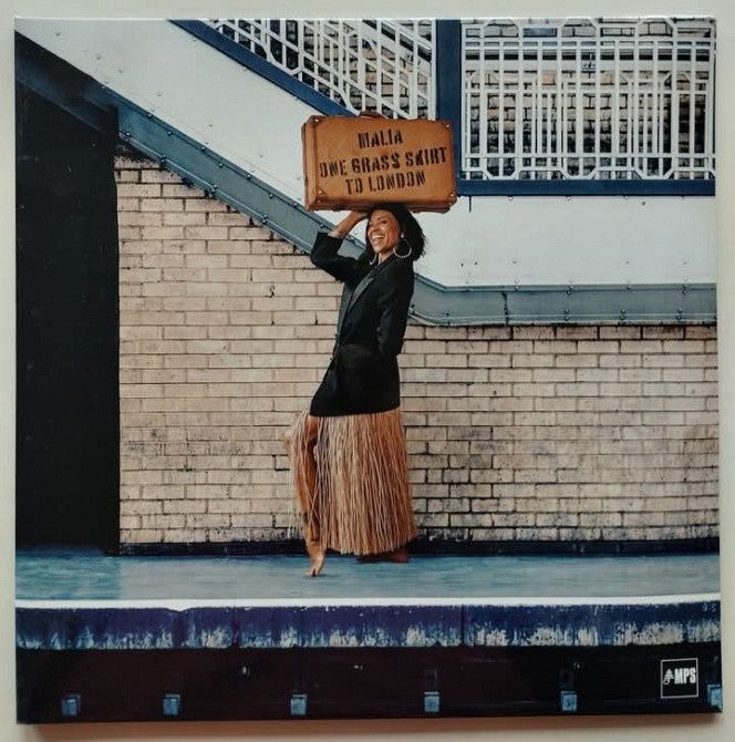 Malia – One Grass Skirt To London