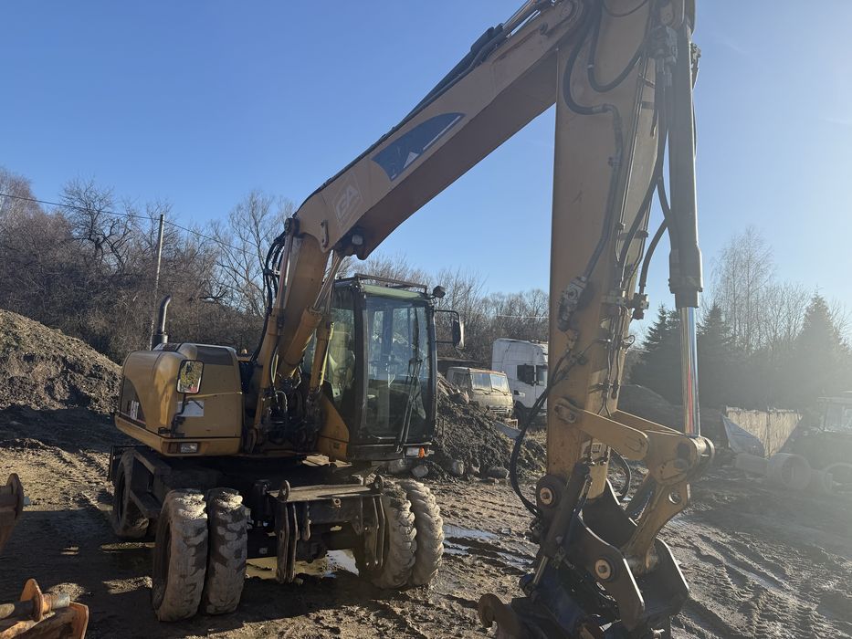 Koparka cat 313c Rototilt