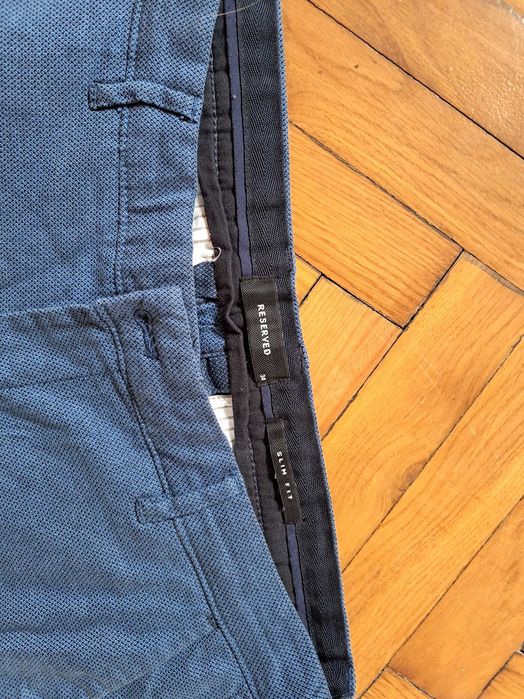 Spodnie meskie niebieskie, Reserved, slim, uszkodzone r. 34