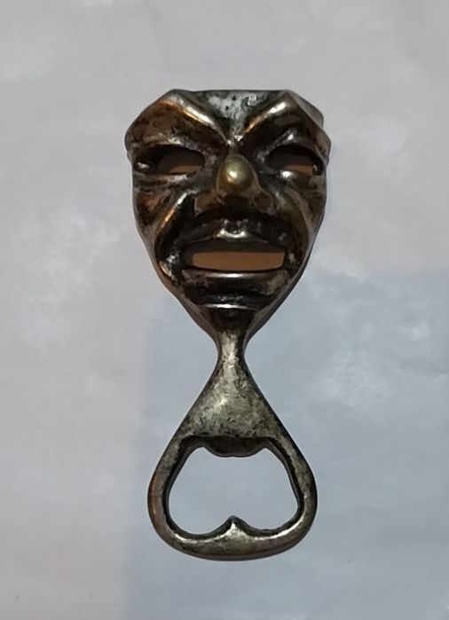 Abre cápsulas antigo em metal