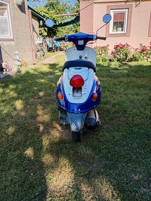 Скутер  Сузукі верде