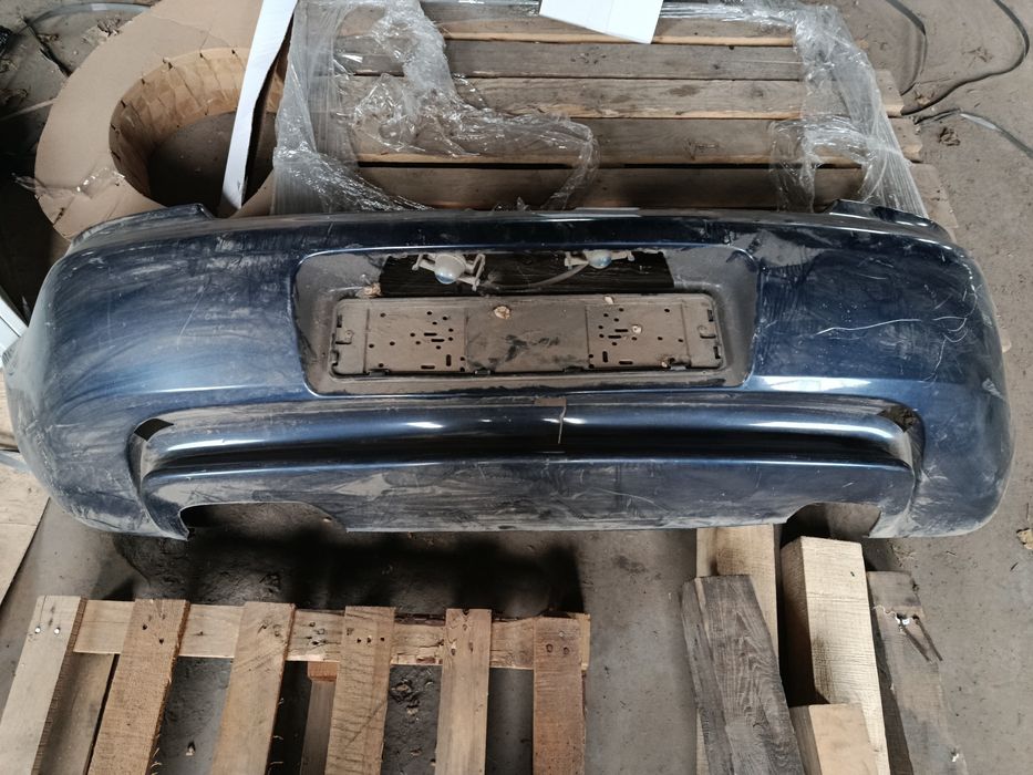 Бампер задний на Мазда 323ф