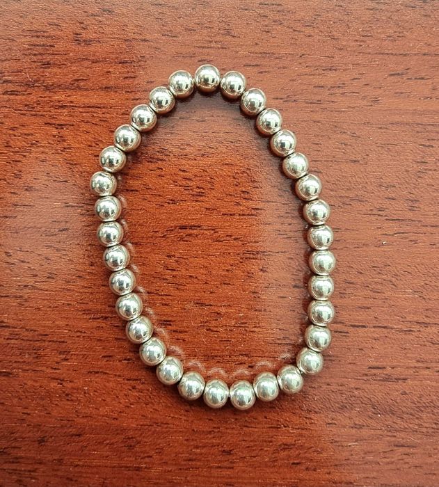 Pulseira cinzenta/ prateada fina