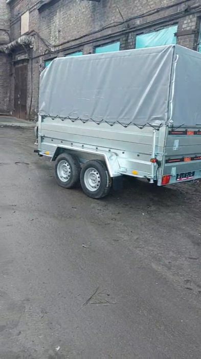 Причіп оцинкований,з двойними бортами, двух осевий, з гальмами.