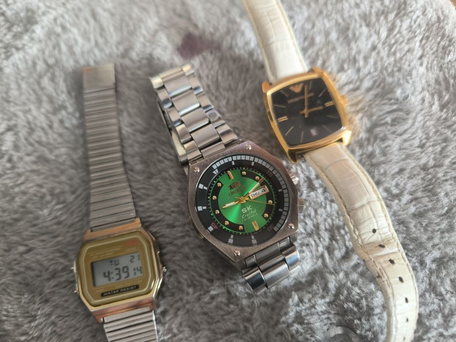 3 zegarki orient Armani i jakis elektroniczny