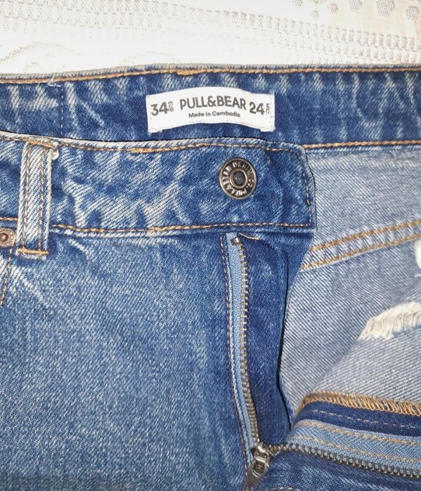 Calças de ganga mom fit com rasgões