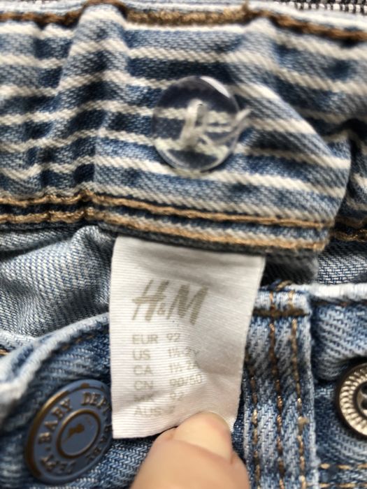 Spodnie dzinsowe z przetarciami 92