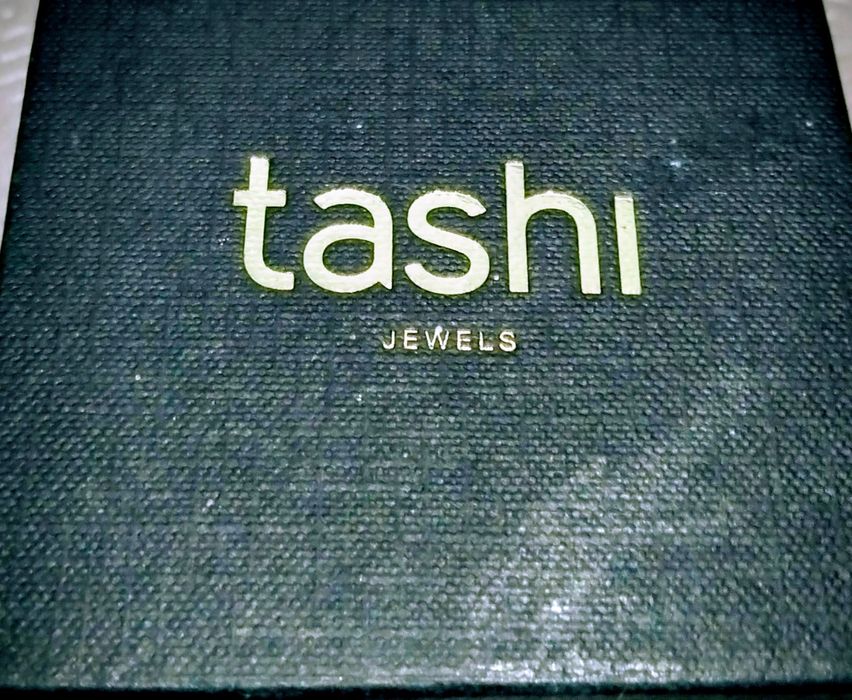 Vendo brincos de prata com ouro marca Tashi