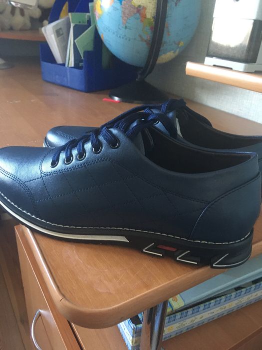 Нові шкіряні туфлі