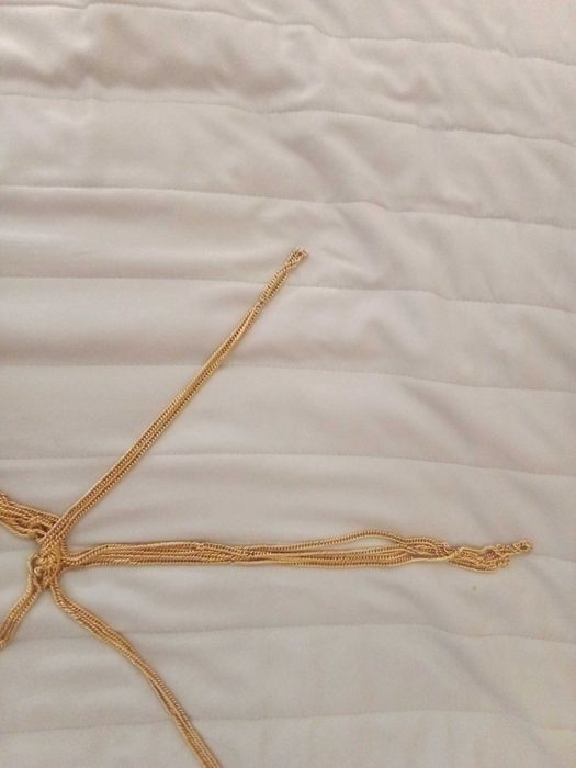 Bordão de metal dourado