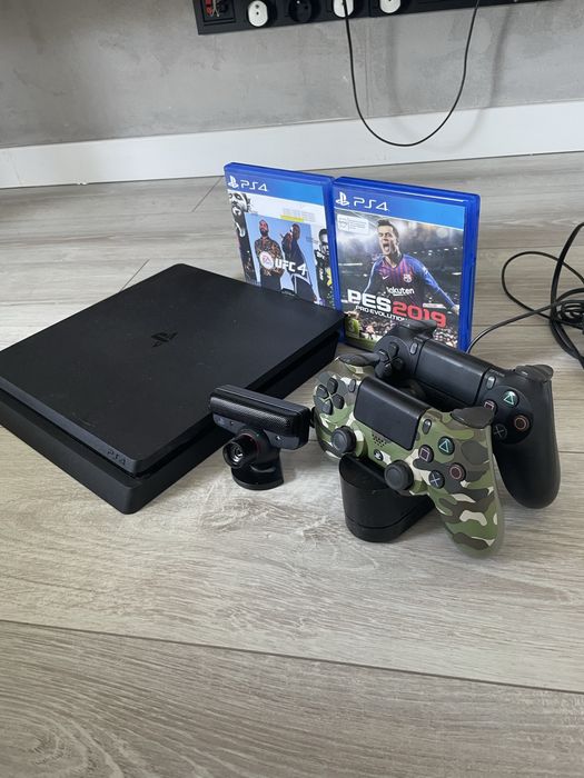 PlayStation 4 Slim 1TB + 2 pady + stacja ładująca + 2 gry + kamerka PS Eye