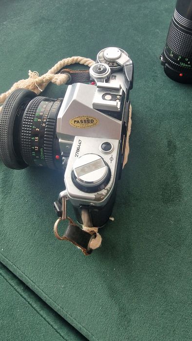 Canon AE-1 + Lente 50mm f/1.8 + Lente 135mm + Flash + Bolsa