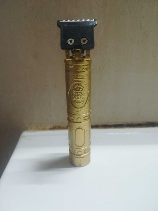 Máquina barbear portátil