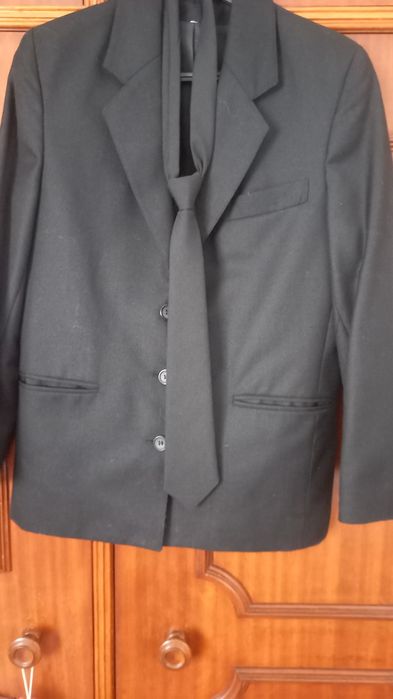 Fato de traje académico de mulher.