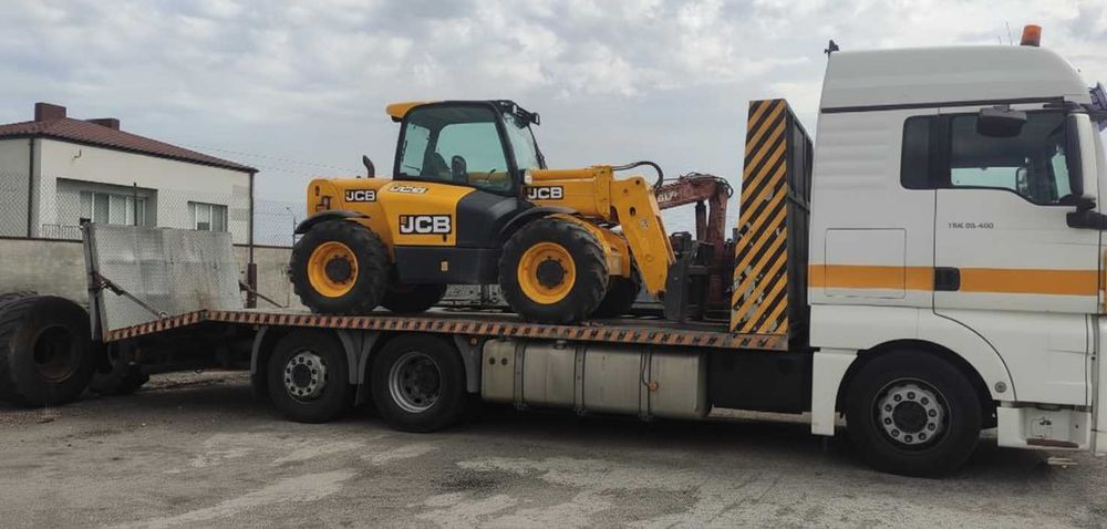 Transport maszyn pojazdów usługi transportowe Autolaweta Pomoc drogowa