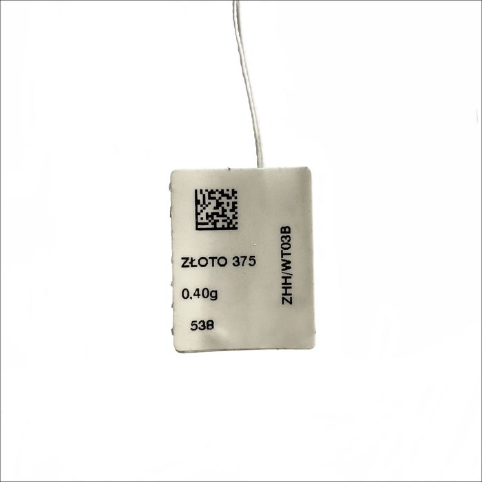 Subtelny wisiorek z białego złota i topazu_W.KRUK