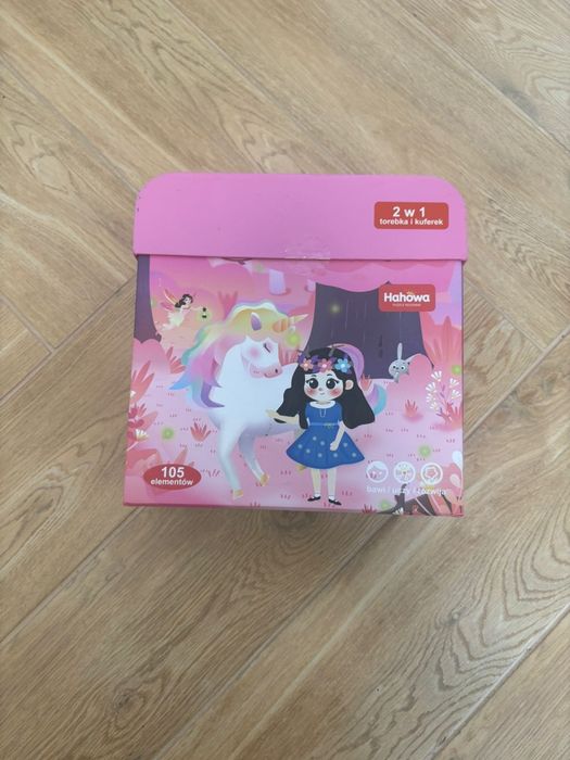 Puzzle rodzinne Magiczny jednorożec 105 elementów 2 w 1 Torebka i kufe