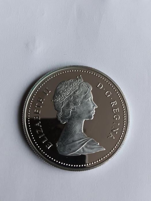 Moeda prata prof dólar. Canadá de 1986.