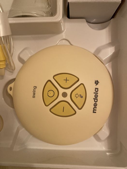 Електронный молокоотсос medela