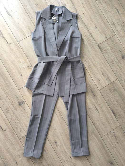 Брюки нові сірі в смужку