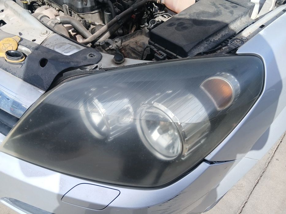 Ótica / farol esquerda OPEL Astra H Caravan (L35)