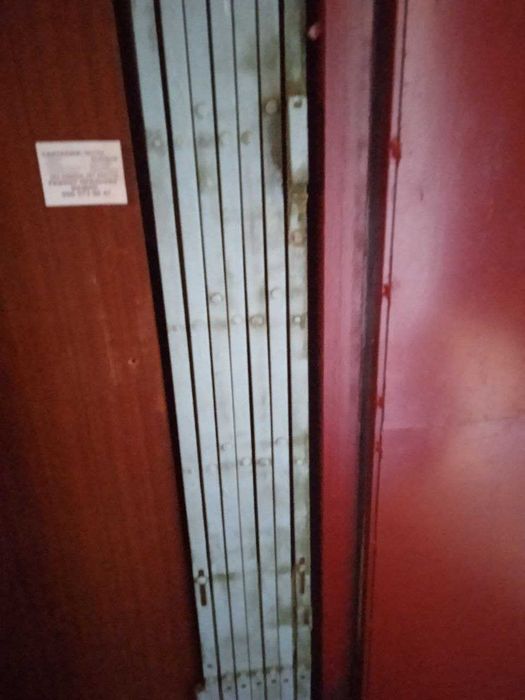 Дверна решітка розсувна - дві створки.