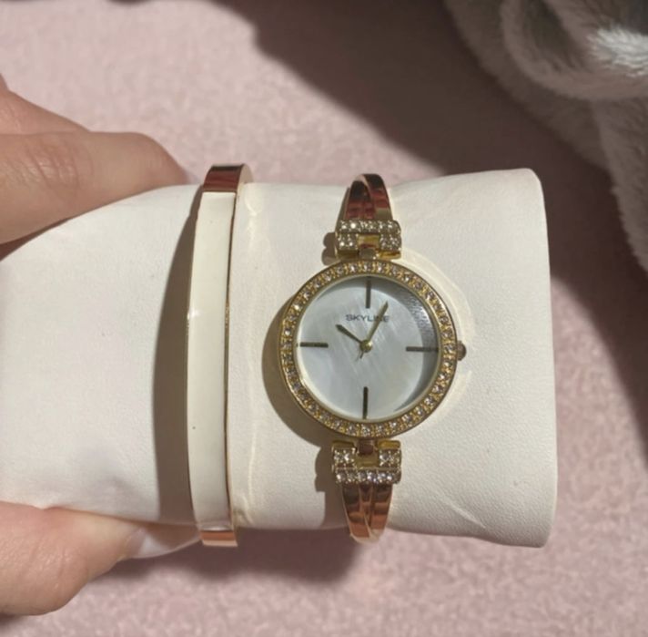 relogio e pulseira skyline