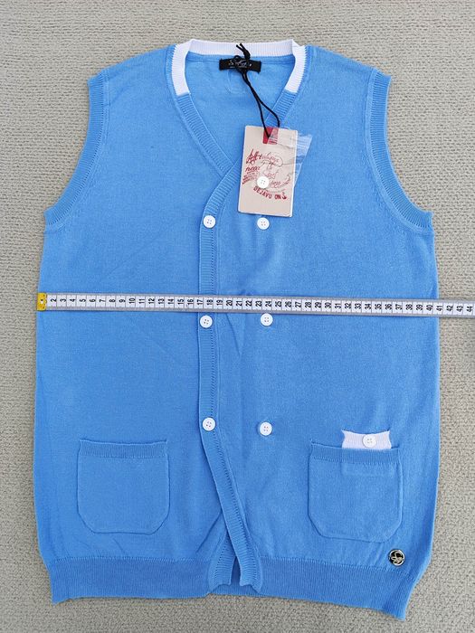 Піджаки, жилетки, кофтинки, гортайте фото