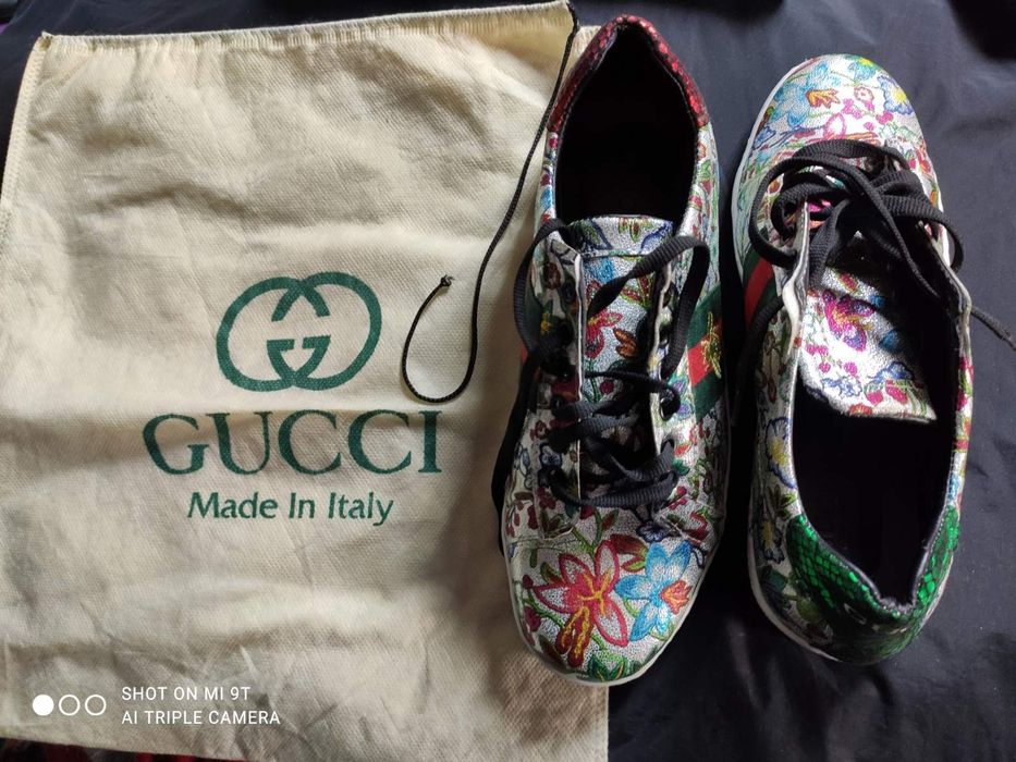 Кросівки Gucci Ace з квітковим принтом.