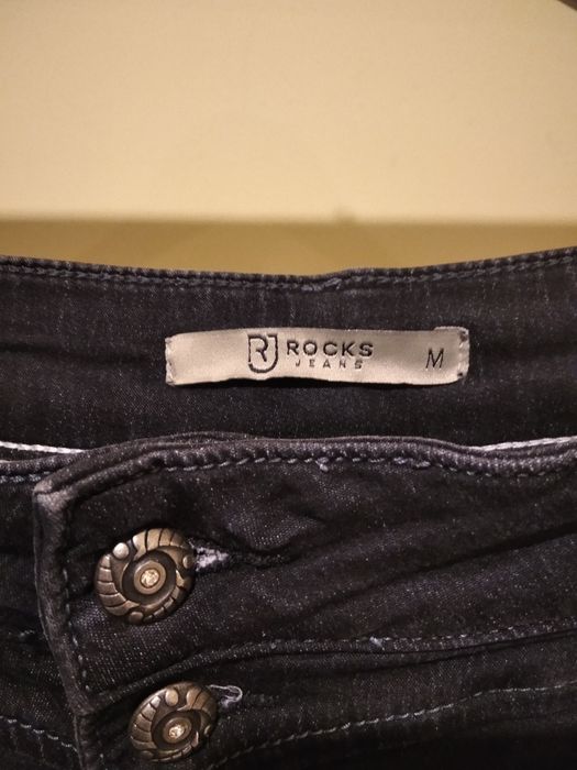 Czarne jeansy damskie w rockowym stylu rozm.M