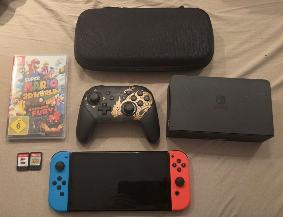 Nintendo Switch OLED Neon Czerwony/Niebieski + Pro Controller + 2 gry