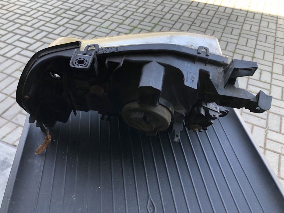 Farol  esquerdo nissan navara  original