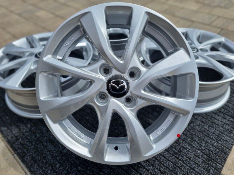 Mazda 2 felgi 15 " aluminiowe nowe 4x100 alufelgi Srebrne / Czarne