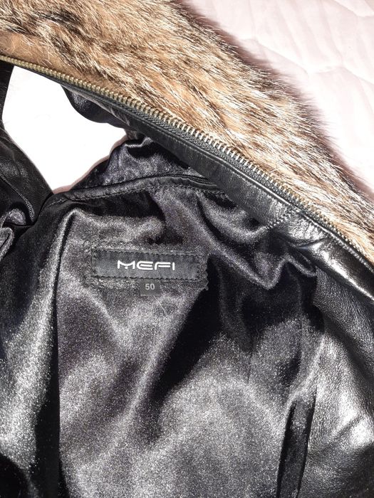 Кожаная куртка- жилетка.