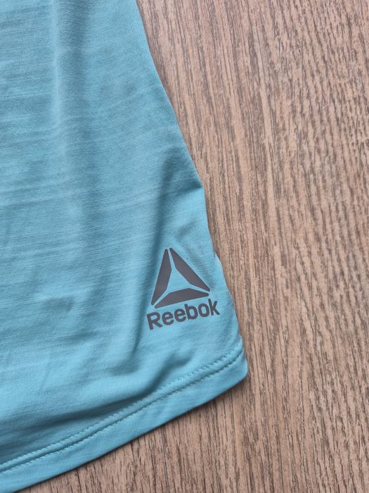 Bokserka koszulka treningowa Reebok M
Kolor miętowy
Normalne ślady uży