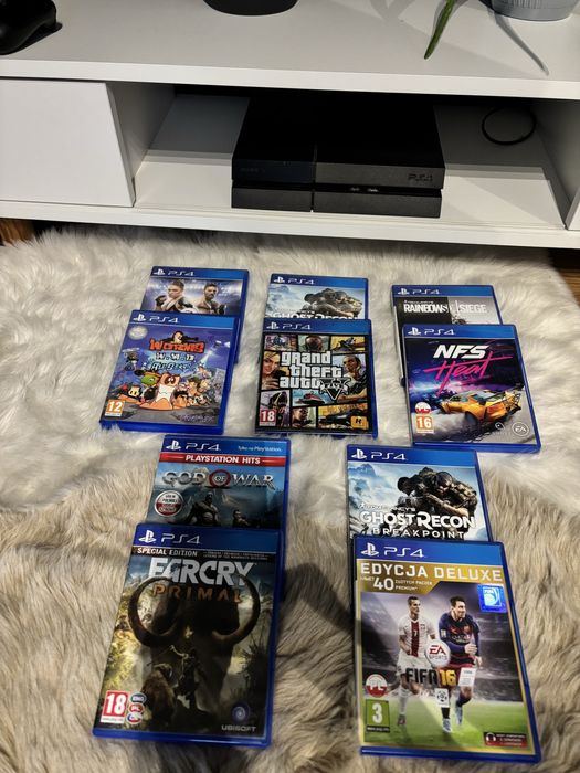 Konsola ps4 fat 2 pady oklablowanie i 10 gier