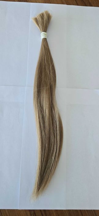 Włosy w kitce ciemny blond waga 44 gram długość 48 cm.